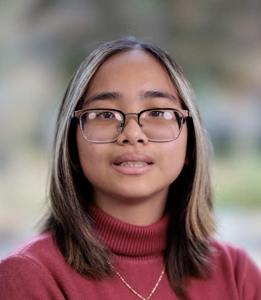 A professional headshot of Mai Tran, looking and smiling at the camera, wearing glasses and turtleneck sweatshirt. This profile photo is added  for accessibility to Mai Tran Intro Blog Post as a DSI in Winter 2026.